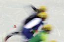 Skaters compete during a women's 500m short track speedskating race at the 2014 Winter Olympics, Monday, Feb. 10, 2014, in Sochi, Russia. (AP Photo/Morry Gash)