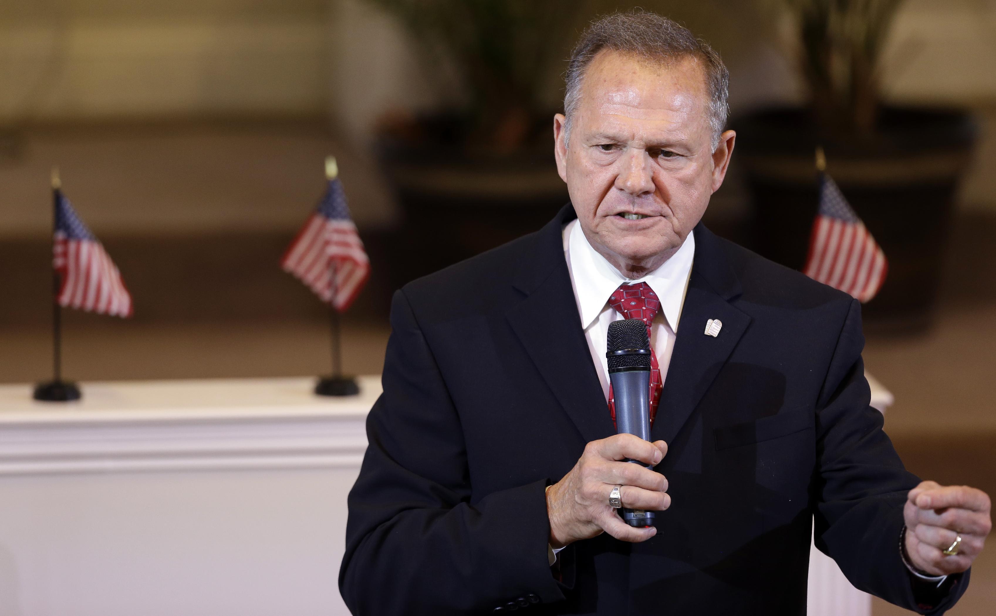 Alabama Supreme Court Chief Justice Roy Moore speaks to the congregation of Kimberly Church of God, Sunday, June 28, 2015, in Kimberley, Ala. (AP Photo/Butch Dill)