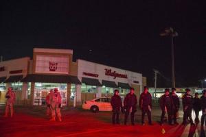 National Guard troops and police officers guard a Walgreens &hellip;