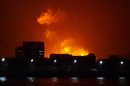 The night sky is lit up as a fire burns aboard INS Sindhurakshak, an Indian Navy kilo class submarine early Wednesday Aug. 14, 2013, in Mumbai, India. An Indian navy submarine caught fire after an explosion aboard the vessel, and sank with some people still aboard, the Defense Agency said Wednesday. The number of casualties remains unknown at this time. (AP Photo / Vikalp Shah via APTN) TV OUT