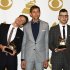 Members of fun., from left, Nate Ruess, Andrew Dost and Jack Antonoff, pose backstage with the song of the year award for "We Are Young" at the 55th annual Grammy Awards on Sunday, Feb. 10, 2013, in Los Angeles. (Photo by Matt Sayles/Invision/AP)