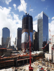In this April 25, 2011 file photo, work continues on “One World Trade Center”, center, in New York. More than a decade after 9/11, no one's quite sure what to call the spot that was once a smoldering graveyard but is now the site of the fast-rising, 1,776-foot skyscraper that will replace the twin towers. Some are calling the new skyscraper "One World Trade Center," but it's still "ground zero" to others. (AP Photo/Mark Lennihan)