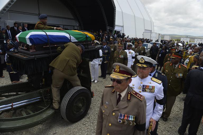 The coffin of South African former president Nelson Mandela leaves for a traditional burial in Qunu on December 15, 2013