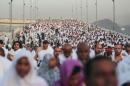 Hundreds of thousands of Muslim pilgrims make their way to cast stones at a pillar symbolizing the stoning of Satan, in a ritual called "Jamarat," the last rite of the annual hajj, on the first day of Eid al-Adha, in Mina near the holy city of Mecca, Saudi Arabia, Thursday, Sept. 24, 2015. (AP Photo/Mosa'ab Elshamy)