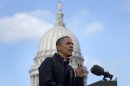 With the Wisconsin State Capitol building dome behind him, President Barack Obama speaks at a campaign event, Monday, Nov. 5, 2012, in downtown Madison, Wis. (AP Photo/Carolyn Kaster)