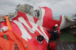 Indonesian officials examine the wreckage from AirAsia&nbsp;&hellip;