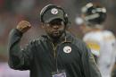 Pittsburgh Steelers head coach Tomlin directs his team's play in the third quarter of play against the Minnesota Vikings during their NFL football game at Wembley Stadium in London