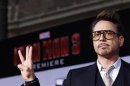 Cast member Robert Downey Jr. poses at the premiere of "Iron Man 3" in Hollywood