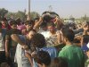 Residents carry the bodies of Abu Al-Laith and Abu Hafeth, whom activists say were killed by forces loyal to Syria's President Bashar al-Assad, during their funeral at Binsh