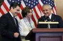 House Democratic Leader Nancy Pelosi, D-Calif., center, is seen with Guatemalan President Otto Molina, right, and Honduran President Juan Hernández on Thursday, July 24, 2014 on Capitol Hill in Washington. The Obama administration is weighing giving refugee status to young people from Honduras as part of a plan to slow the influx of unaccompanied minors arriving at the U.S.-Mexico border, White House officials said Thursday. The plan would involve screening youths in Honduras, one of the world's most violent nations, to determine whether they qualify for refugee status. (AP Photo/Lauren Victoria Burke)