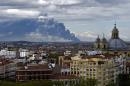 A huge smoke column caused by a fire at a tyre dump near the town of Sesena pictured from the Almudena cathedral in Madrid on May 13, 2016