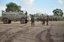 AMISOM soldiers arrive in the town of Kurtunwaarey, Somalia after liberating it from Shabab rebels on August 31, 2014