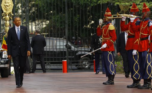 U.S. President Obama is greeted by the honor guard at the Presidential Palace in Dakar, Sengal