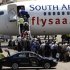 Passengers board a South African Airways Boeing 737 aircraft at the Kamuzu International Airport in Lilongwe