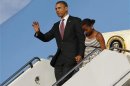 U.S. President Barack Obama steps off Air Force One with Sasha in Chicago