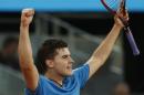 Dominic Thiem from Austria celebrates his victory during a Madrid Open tennis tournament match against Stanislas Wawrinka from Switzerland, in Madrid, Spain, Tuesday, May 6, 2014. (AP Photo/Andres Kudacki)