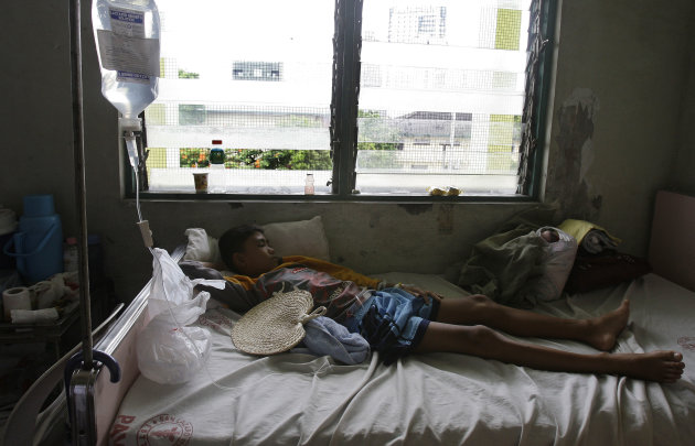 In this photo taken Thursday, June 9, 2011, a Filipino boy lies on his bed at the pedia dengue ward at San Lazaro Hospital in Manila, Philippines. ASEAN health ministers have designated Wednesday, June 15 as ASEAN Dengue Day in a bid to raise public awareness on dengue prevention and control at the regional and national level. (AP Photo/Aaron Favila)