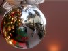 In this Thursday, Dec. 20, 2012, photo, a holiday shoppers reflected in a ornament handing from a large Christmas tree at Fashion Island shopping center in Newport Beach, Calif. Thursday, Dec. 20, 2012. U.S. holiday retail sales this year are the weakest since 2008, after a shopping season disrupted by storms and rising uncertainty among consumers.  A report out Tuesday that tracks spending, called MasterCard Advisors SpendingPulse, says holiday sales increased 0.7 percent. Analysts had expected sales to grow 3 to 4 percent. (AP Photo/Chris Carlson)