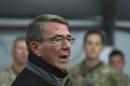 U.S. Defense Secretary Ash Carter speaks to Iraqi and U.S. soldiers at the Qayara air base, that serves as a staging point for the Mosul battle, south of Mosul, Iraq, Sunday, Dec. 11, 2016. Iraqi and U.S.-led coalition forces have killed or gravely wounded more than 2,000 Islamic State fighters in the battle for Mosul since October, Carter said Sunday. Recapturing the city, Iraq's second-largest, is crucial to the Iraqis' hopes of restoring their sovereignty, although political stability will likely remain a challenge afterward. (AP Photo/Hadi Mizban)