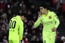 FC Barcelona's Luis Suarez of Uruguay, right, celebrates his goal against Athletic Bilbao with teammate Lionel Messi of Argentina, during their La Liga soccer match at San Mames stadium in Bilbao, northern Spain, Sunday, Feb. 8, 2015. (AP Photo/Alvaro Barrientos)
