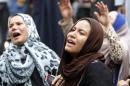 Relatives and families of members of the Muslim Brotherhood and supporters of ousted President Mursi react in front of the court in Minya
