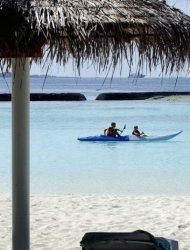 File photo shows tourists in a kayak off Kurumba island, Maldives. Dozens of tiny islands in the Maldives are battling rising sea levels that threaten to wipe them off the face of the earth