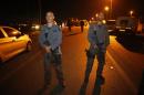 Israeli police officers stand guard at the scene of a stabbing attack near the West Bank Jewish settlement of Alon Shvut