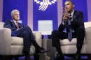 President Barack Obama, right, with former President Bill Clinton, left, speaks at the Clinton Global Initiative in New York, Tuesday, Sept. 24, 2013. (AP Photo/Pablo Martinez Monsivais)