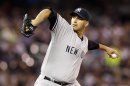 Yankees' Pettitte throws against Twins during first inning of their American League MLB baseball game in Minneapolis