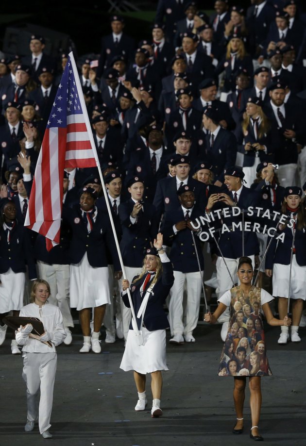 Flag bearer Mariel Zagunis of the U.S. holds the national flag as she leads the contingent in the athletes parade during the opening ceremony of the London 2012 Olympic Games at the Olympic Stadium