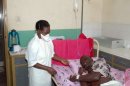 A nurse takes care of a patient with the Ebola virus in a Ugandan hospital in 2007