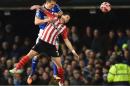 Southampton's Irish striker Shane Long (R) vies for the ball with Ipswich Town's Scottish defender Christophe Berra during their English FA Cup Third Round football match replay in Ipswich, Suffolk on January 14, 2015