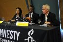 Officials of Amnesty international Lucy Freeman, Salil Shetty and Steve Crawshaw speak during a news conference in Nigeria's capital Abuja