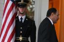 A member of the U.S. Army stands guard as Iraqi Prime Minister Nuri al-Maliki walks into the Naval Observatory, October 30, 2013 in Washington