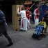 Spaniards dressed up like Bishops for a stag party play the role of a confessor in downtown Madrid, Saturday June 9 2012. Spain will ask for a bank bailout from the eurozone, becoming the fourth and largest country to seek help since the single currency bloc's debt crisis erupted.(AP Photo/Daniel Ochoa de Olza)