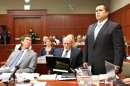 George Zimmerman, right, stands up at the defense table with his attorneys, Mark O'Mara, left, and Don West, center, as he is identified by state witness Doris Singleton, a Sanford police officer, during her testimony in Zimmerman's trial in Seminole circuit court, in Sanford, Fla., Monday, July 1, 2013. Zimmerman has been charged with second-degree murder for the 2012 shooting death of Trayvon Martin.(AP Photo/Orlando Sentinel, Joe Burbank, Pool)