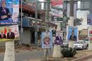 Election posters are hung along a street in the northern Iraqi city of Kirkuk, on April 1, 2014