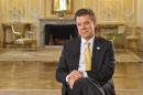 Colombian President Juan Manuel Santos smiles during an interview with AFP at Narino Palace in Bogota on October 24, 2014