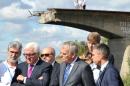 German Foreign Minister Frank-Walter Steinmeier (2nd left) and his French counterpart Jean-Marc Ayrault (3rd right) stand in front of a destroyed bridge during a visit in Slavyansk, eastern Ukraine, on September 15, 2016