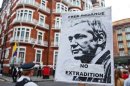 A sign showing a portrait of WikiLeaks founder Julian Assange outside the Ecuadorian Embassy in London