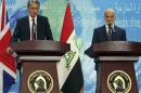 Britain's Foreign Secretary Philip Hammond, left, and his Iraqi counterpart Ibrahim al-Jaafari, give a news conference in Baghdad, Iraq, Monday, Oct. 13, 2014. Hammond says coalition airstrikes will not be enough to defeat the Islamic State group, saying that the Iraqi government, its military and its people play a key role in this fight. The British government is taking part in the U.S.-led aerial campaign combating the Islamic State group. However, it has refused to join the U.S.-led airstrike campaign in Syria. (AP Photo/Karim Kadim)