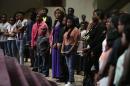 Young parishioners listen to Bishop Larry Jones as he speaks to them about the value of their lives and staying safe in the streets during at Greater Grace Church August 17, 2014 in Ferguson, Missouri