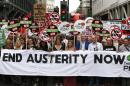 Demonstrators protest against the British government's spending cuts and austerity measures in London on June 20, 2015