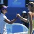 Li Na of China shakes hands with Maria Sharapova of Russia after defeating her in their women's singles semi-final match at the Australian Open tennis tournament in Melbourne