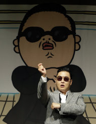 South Korean rapper PSY, who sings the popular "Gangnam Style" song, dances after his press conference in Seoul, South Korea, Tuesday, Sept. 25, 2012. (AP Photo/Lee Jin-man)
