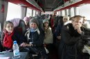 A group of Russian citizens ride a bus shortly after crossing the border from Syria into Lebanon at the Masnaa border crossing Tuesday, Lebanon, Jan. 22, 2013. Some 80 Russian citizens crossed into Lebanon as Moscow began evacuating some of the tens of thousands of Russians who live in Syria. (AP Photo/Bilal Hussein)