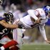 New York Giants quarterback Eli Manning, right, is sacked by Baltimore Ravens inside linebacker Brendon Ayanbadejo in the first half of an NFL football game in Baltimore, Sunday, Dec. 23, 2012. (AP Photo/Nick Wass)