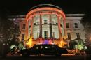 This photo shows the South Portico of the White House in Washington decorated and lit in orange lights in preparation of tomorrow's Halloween celebration on Wednesday, Oct. 30, 2013. President Barack Obama and first lady Michelle Obama will welcome local children and children of military families tomorrow to 'trick-or-treat'. The White House canceled its Halloween celebration last year in aftermath of Superstorm Sandy. (AP Photo/Pablo Martinez Monsivais)