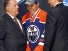 Nail Yakupov, center, a winger from Russia who was chosen first overall by the Edmonton Oilers in the first round of the NHL hockey draft,  stands with Oilers officials on Friday, June 22, 2012, in Pittsburgh. (AP Photo/Keith Srakocic)