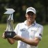 Watney of the U.S. poses with his trophy after winning the Malaysia's Asia Pacific Classic golf tournament in Kuala Lumpur